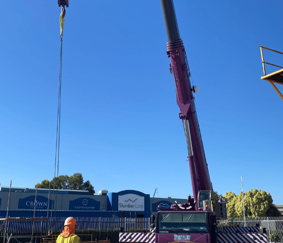 C0 Slewing Mobile Crane (Over 100 Tonnes) / Open Crane Ticket in operation under a clear sky at Saferight's training facility. C0 Crane Ticket Perth - Slewing Mobile Crane in Operation