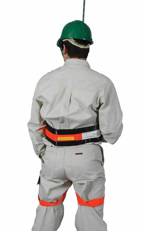 Rear view of person wearing a Saferight rescue strop with padded waist support and leg loops, used for vertical and confined space rescues