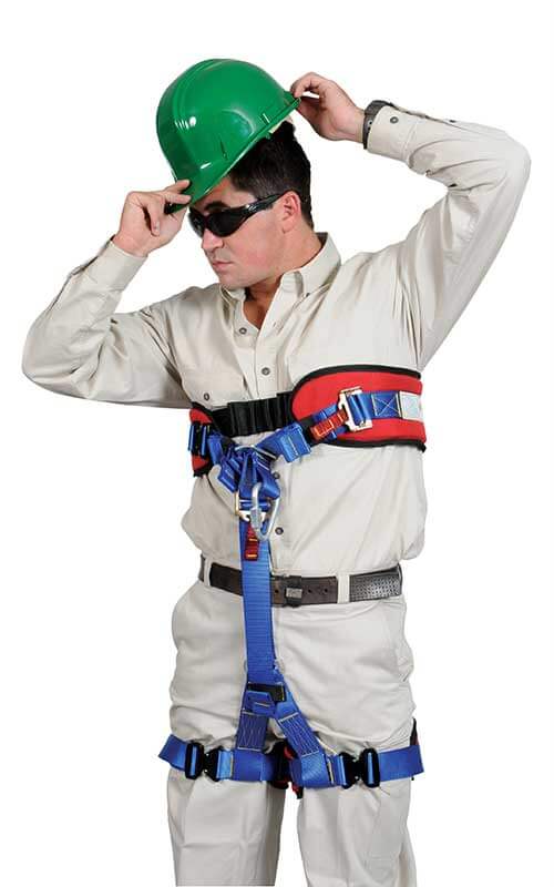Front view of a person wearing a technical rescue strop with blue leg loops and red chest strap, designed for mine and aerial rescue operations